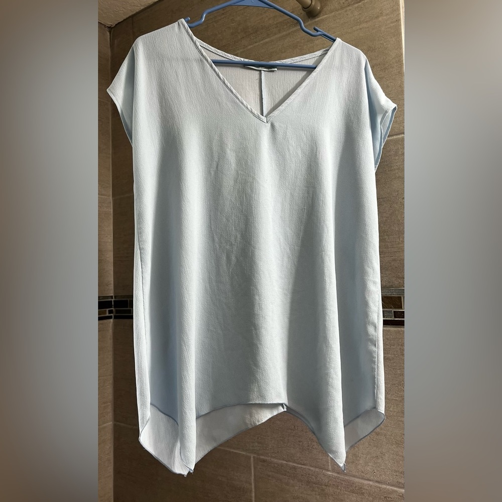 Chatoyant women’s small light blue blouse.